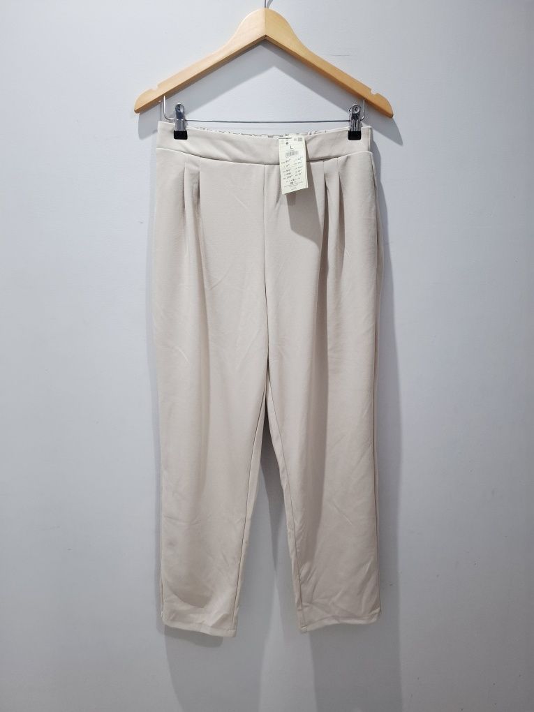 Nowe beżowe spodnie casual reserved l 40