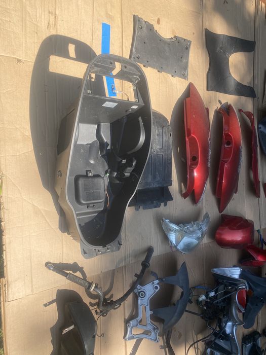 Kymco Grandink 125 owiewka licznik lampa koło zacisk amortyzator bak