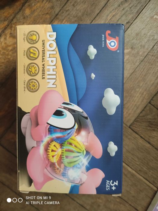 Delfin zabawka grająca świecąca