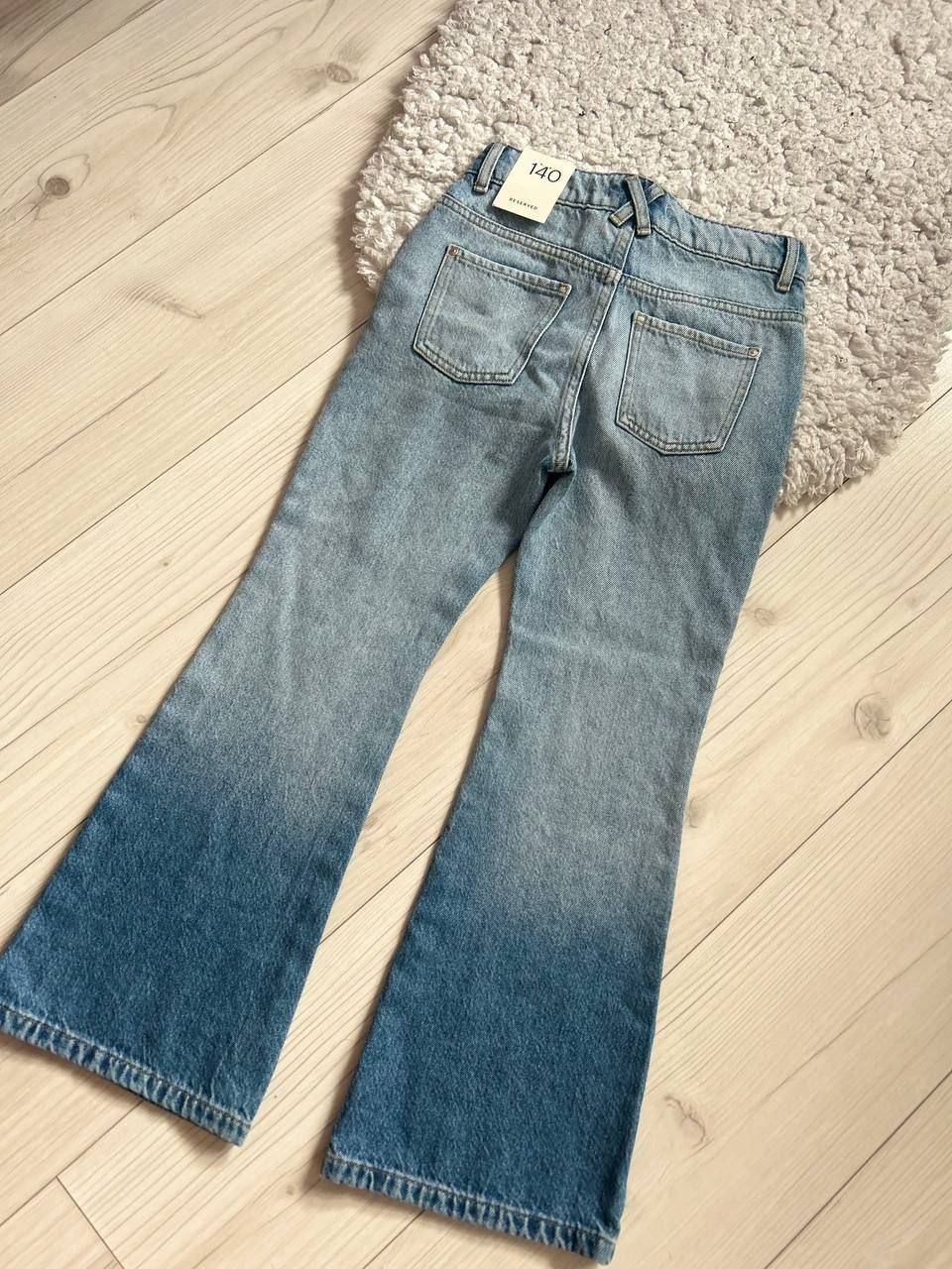 Нові джинси RESERVED для дівчинки 9-10 років з ефектом омбре.