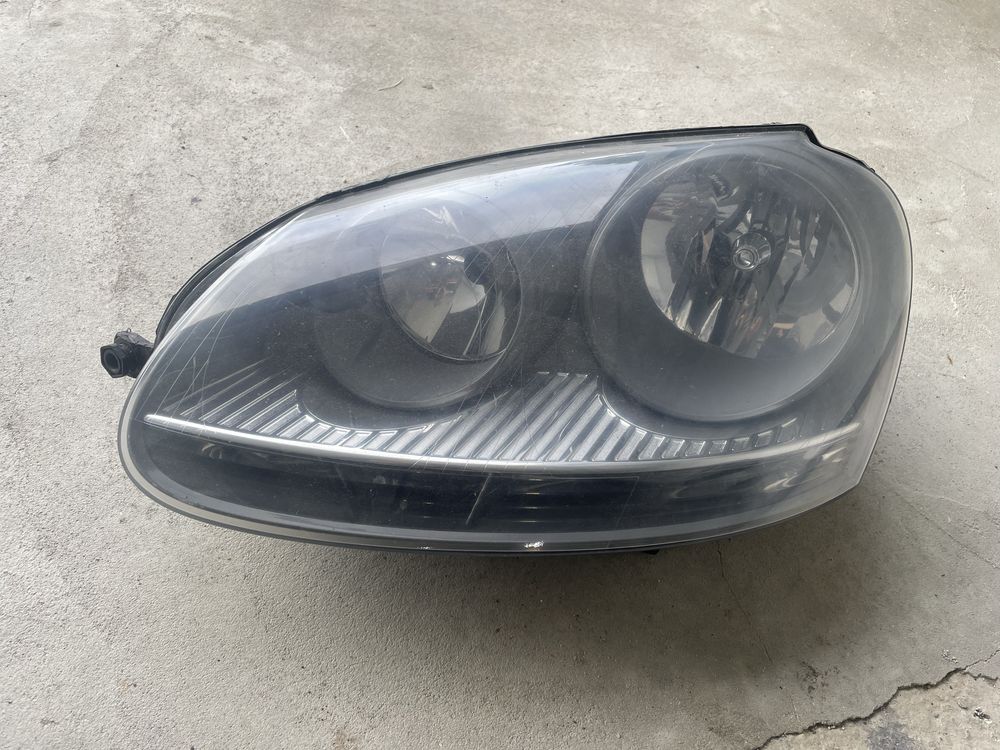 Farol esquerdo Volkswagen Golf 5