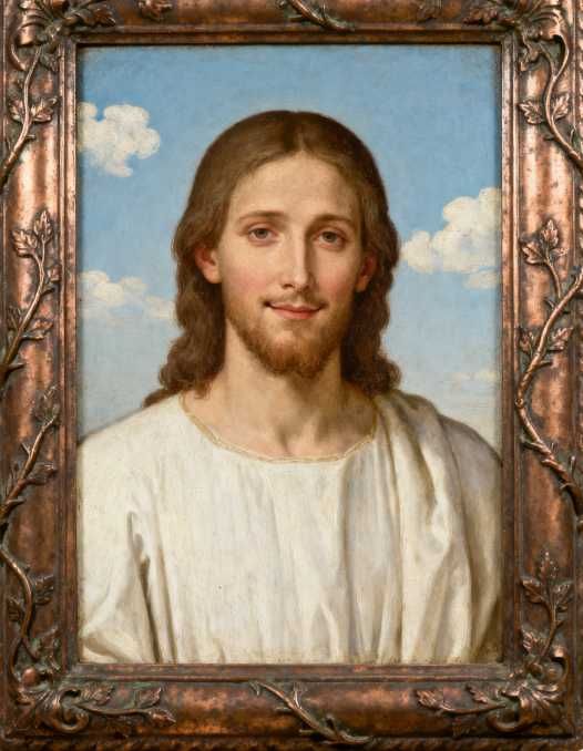 Um pendente personalizado com a imagem de Jesus gravada.