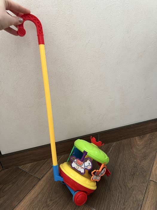 Игрушка-каталка Карусель