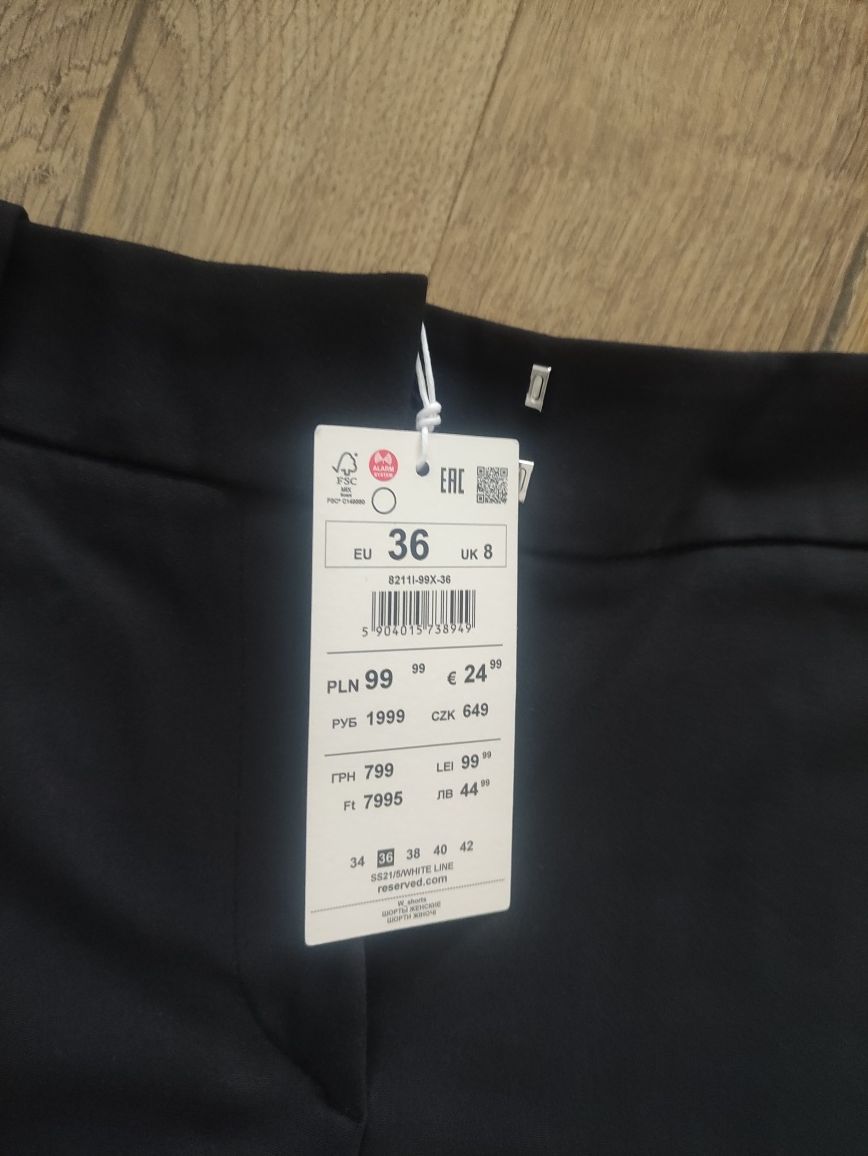 Nowe czarne materiałowe eleganckie shorty do kolan