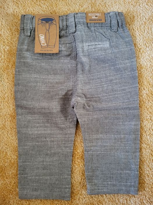 Nowe spodnie Chino Reserved 68, regulacja