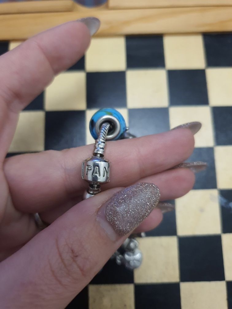 Pulseira em prata com as peças da foto (2 delas de prata)