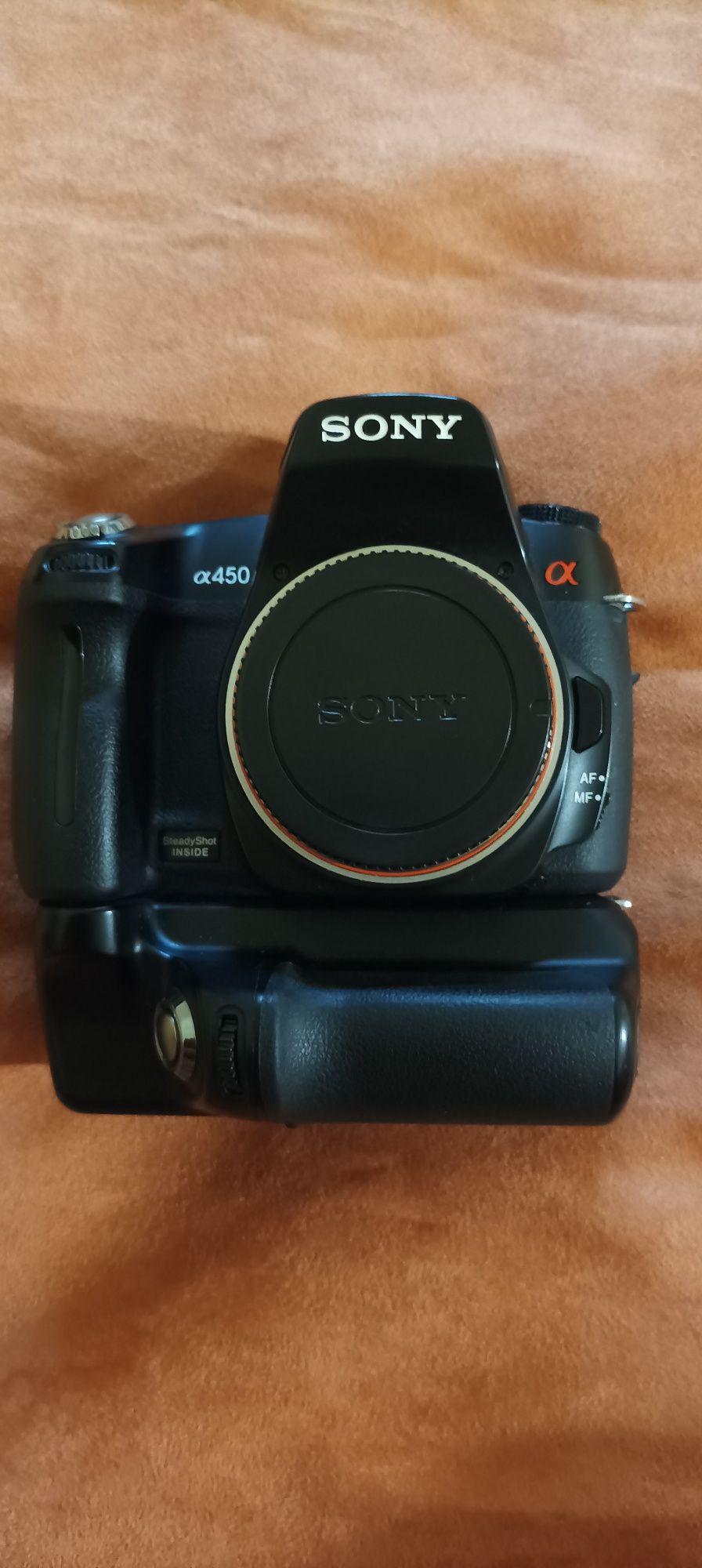 Продам зеркальную камеру Sony a450 с бустером(боди).