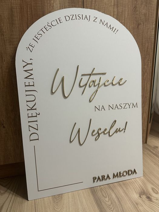 Tablica powitalna, plan stołów, koszyki ratunkowe, pudełko na koperty