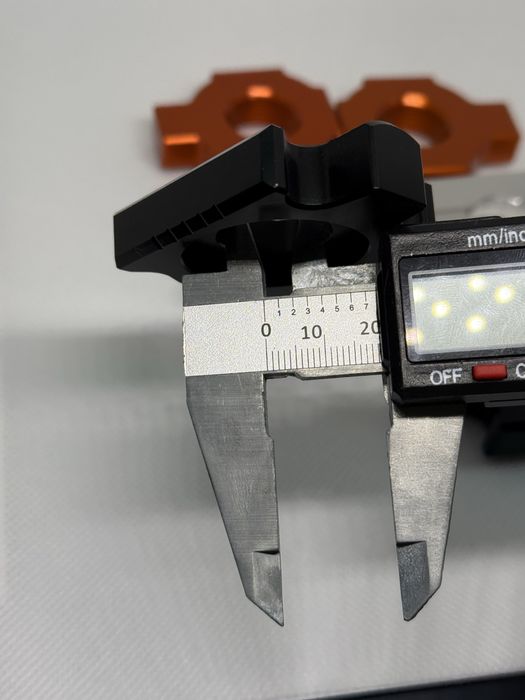 Блок регулювання натяжника для ланцюга