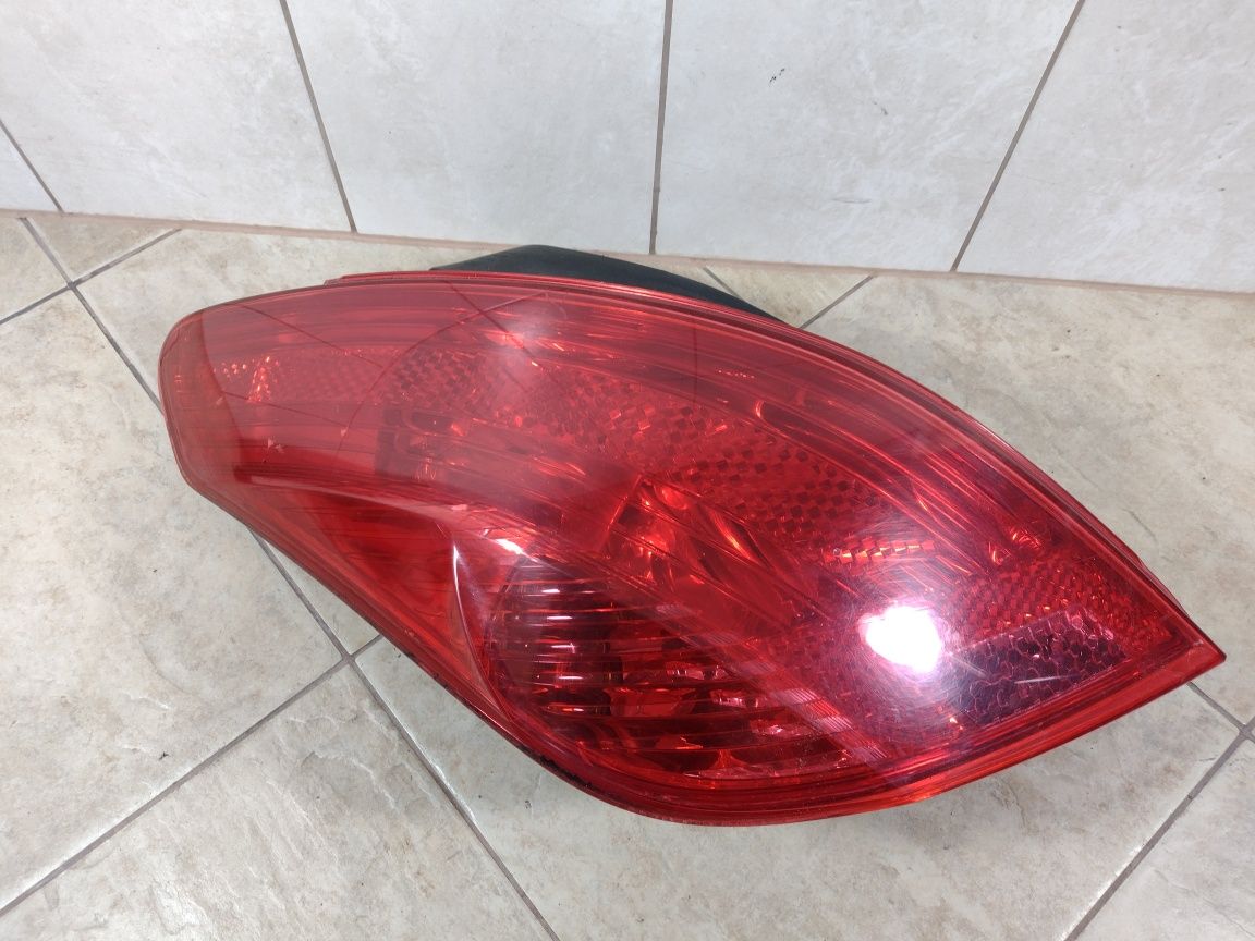 Peugeot 308 HB 3D lampa lewy  tył oryginał wysyłka OLX wkład Europa