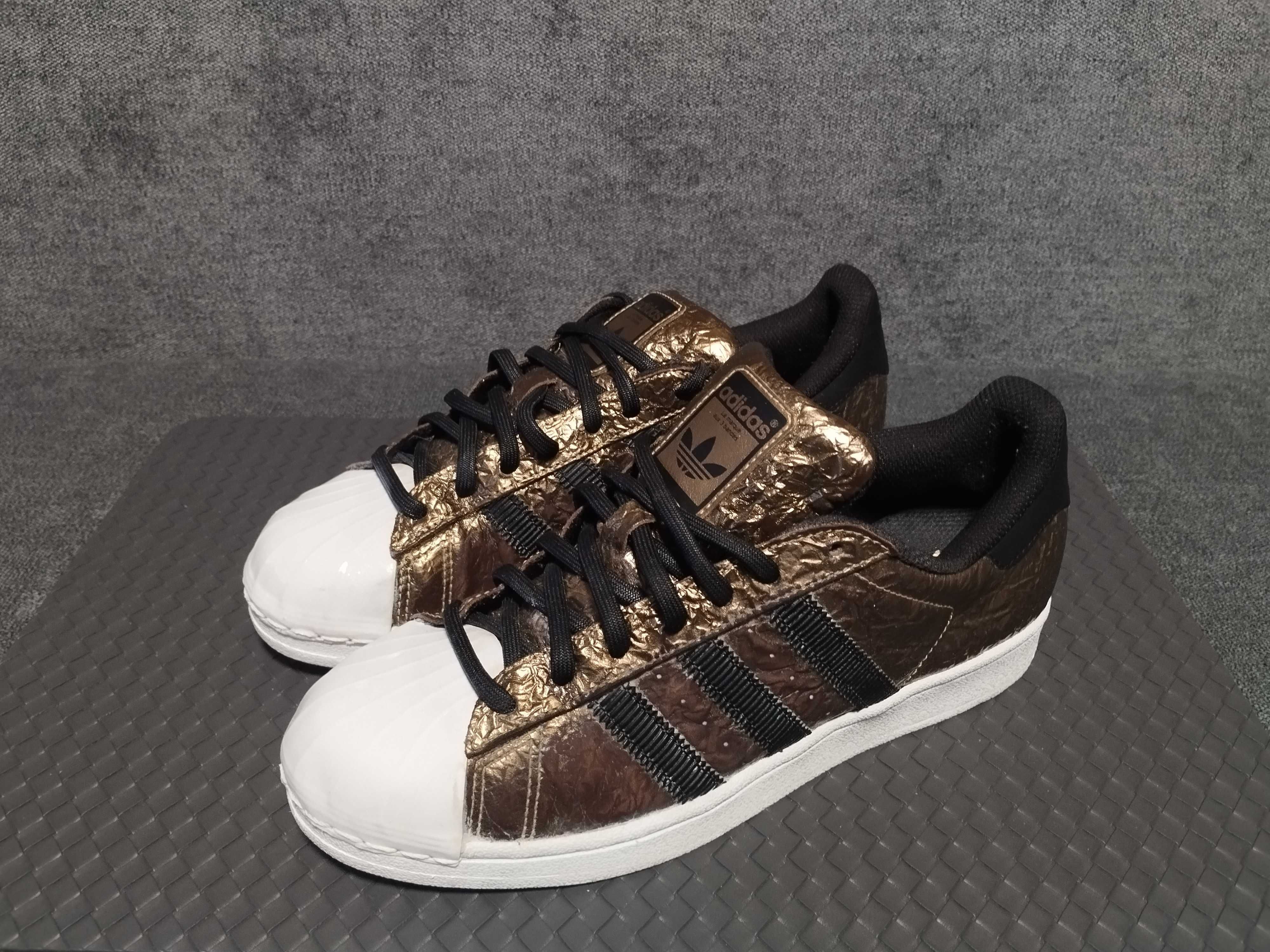 Adidas Superstar metallic foil gold.