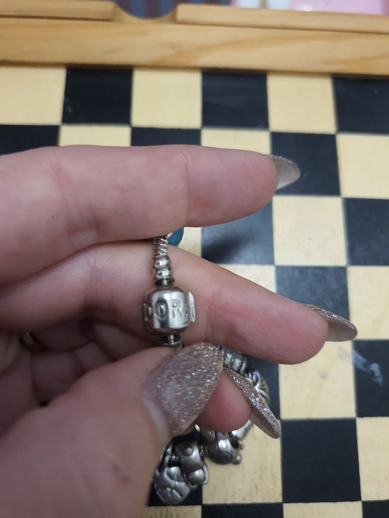 Pulseira em prata com as peças da foto (2 delas de prata)