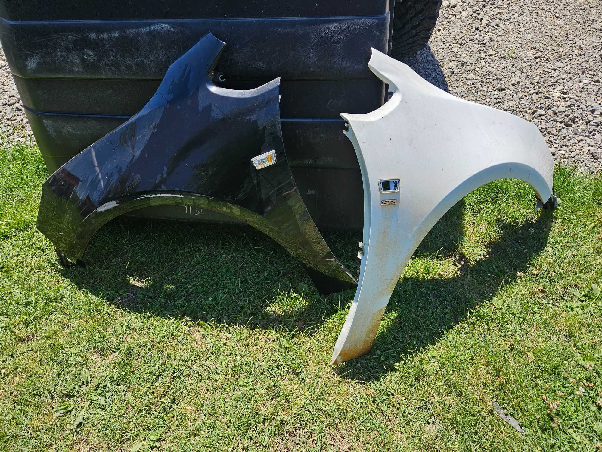 Błotnik Przedni Opel Astra J