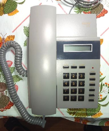 Телефон проводной цифровой многофункциональный “ОКАПИ 201 Н”.
