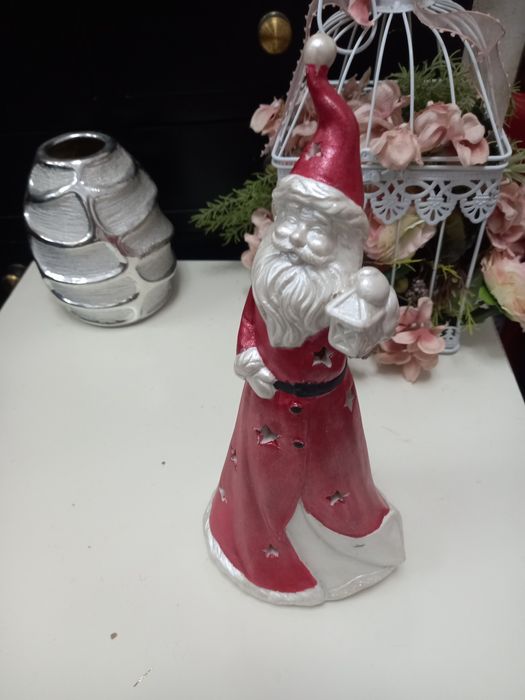 Pai natal em louça  que dá luz