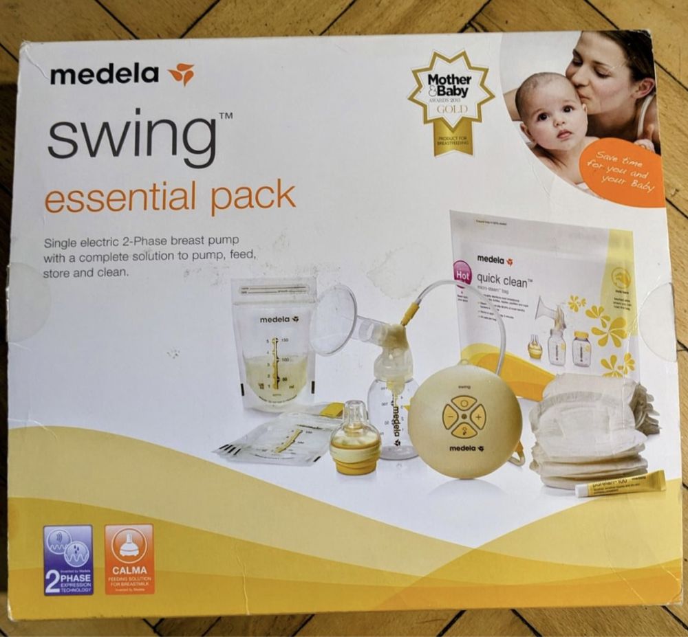Молокоотсос Medela Swing + много дополнений
