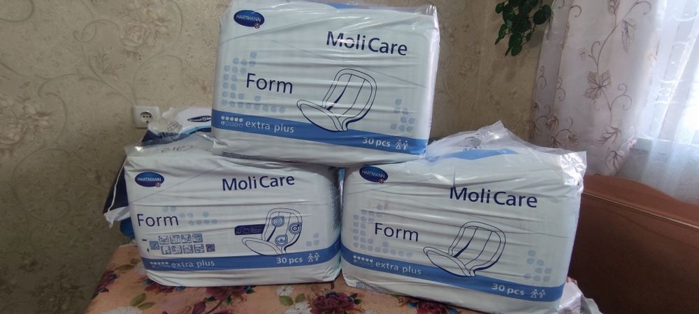 Продам памперсы,прокладки.