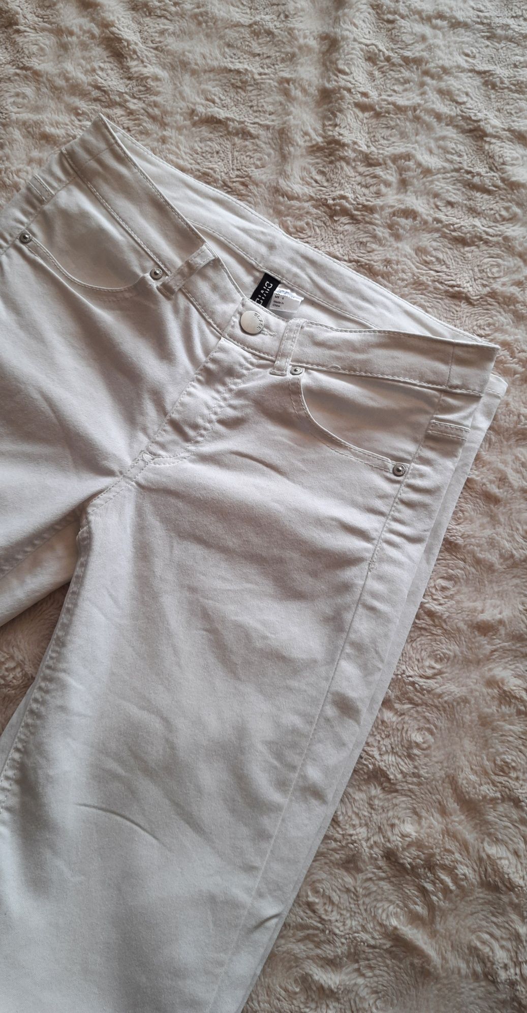 Białe spodnie skinny jeans H&M rozmiar 36