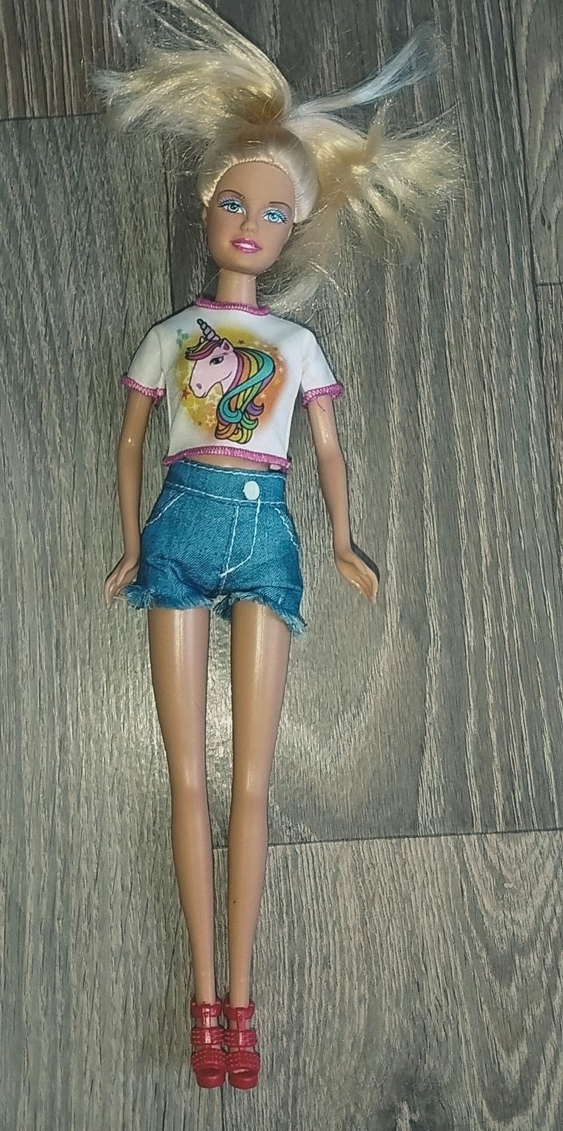 Лялька з одягом  в новому стані