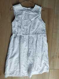 Biała sukienka z ażurowym wzorem