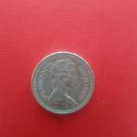 Moneta kolekcjonerska One Pound Elisabeth II z 1983 roku.