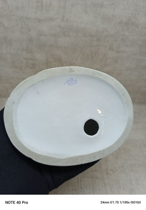 Łomonosow, porcelanowa figurka kota i kucharza.
