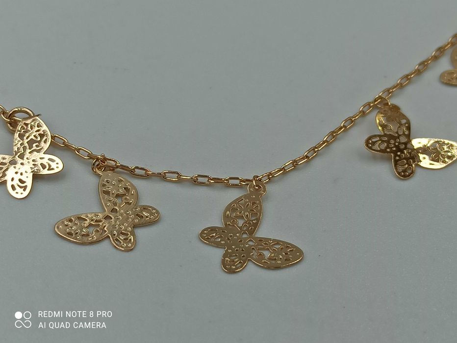 Bransoletka pozłacana 18k złotem na kostkę motylki