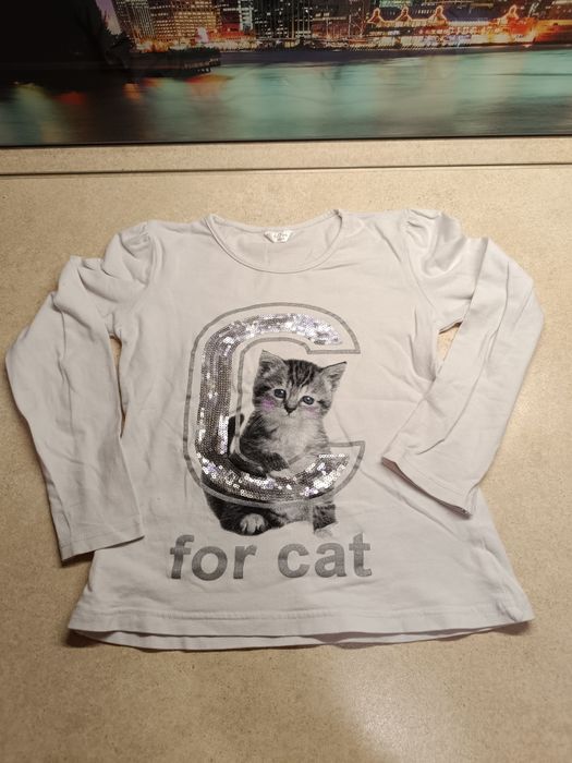 Bluzka biała dziewczęca z długim rękawem z cekinami kotkiem 6-7lat 122