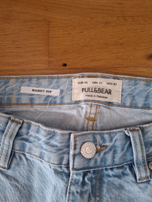 Jeansowe spodnie Pullandbear rozm 40