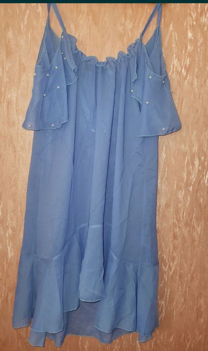 Туника парео с воланом на плечах и жемчугом 44р
Длина 88
Пог 44