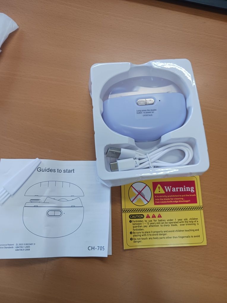 Vendo corta unhas elétrico