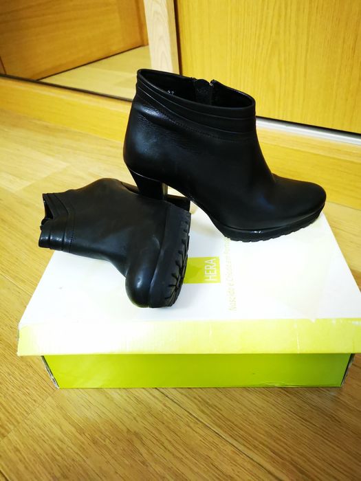 Botins em pele se salto alto com apoio