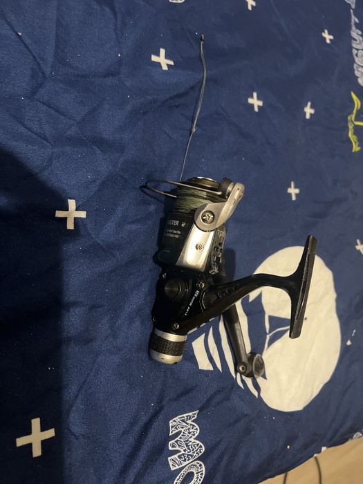 Kolowrotek wędkarski,oraz wszystko na zdjęciu