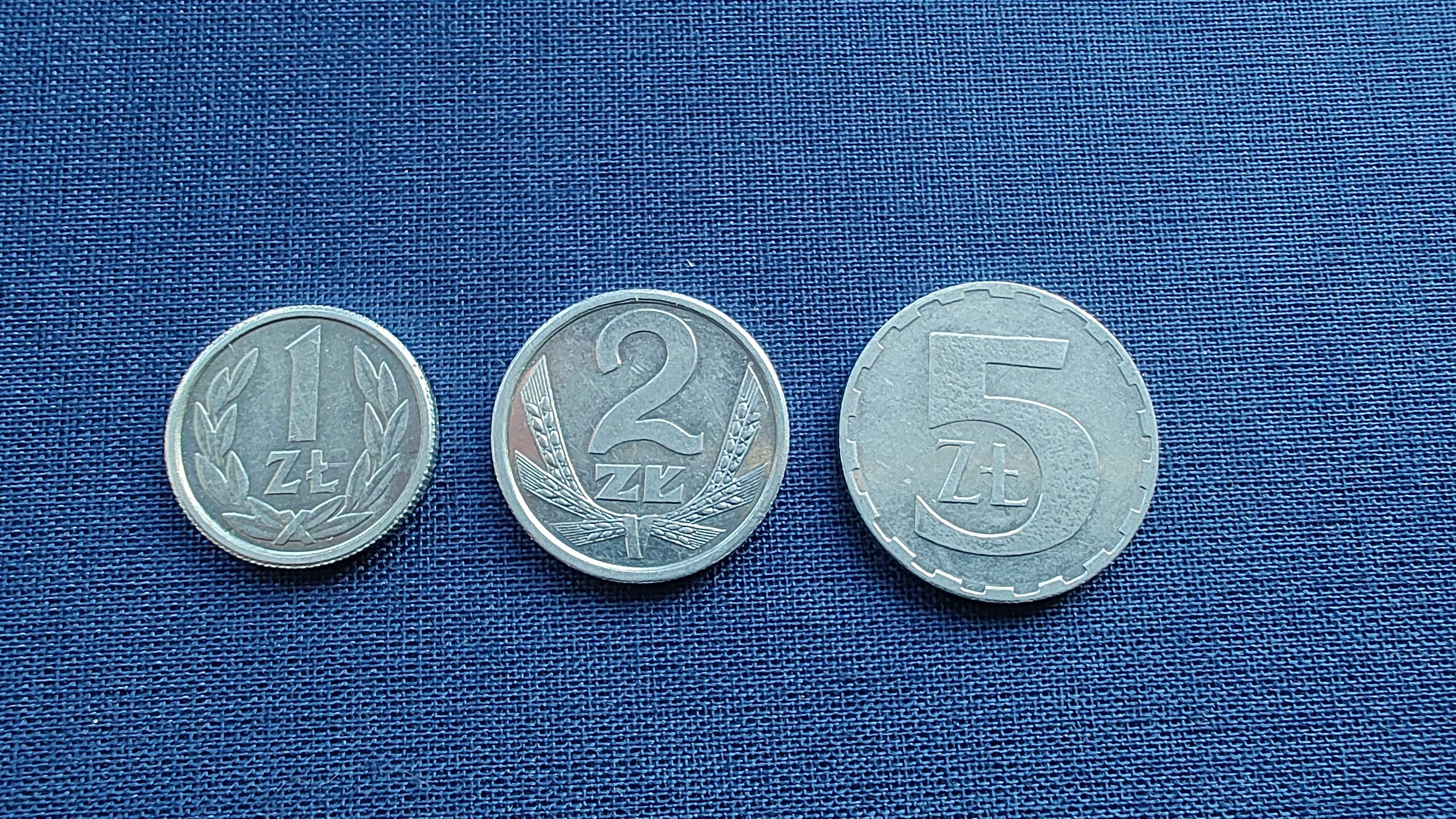 3 monety jeden, dwa i piec złotych.
