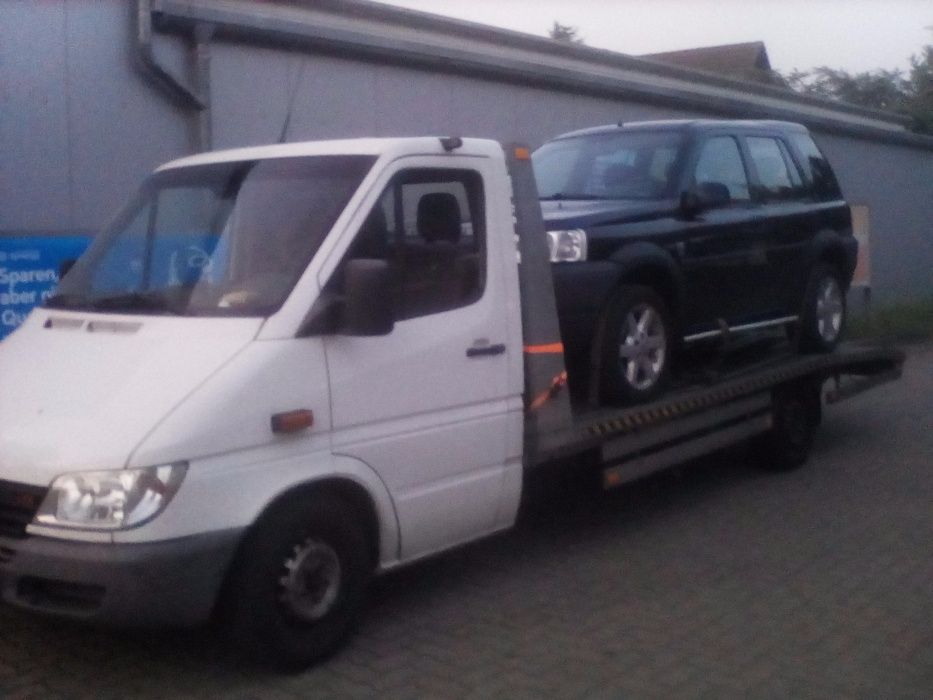 Auto laweta Transport Niemcy Auto Pomoc Tanio Dzwoń 24H.