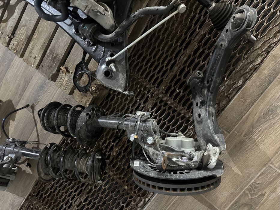 Цапфа ричаг поворотний кулак пружина супорт взборі Toyota BZ4X