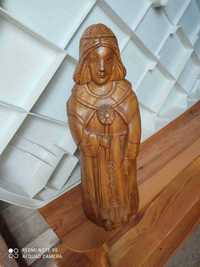 Posąg, drewniana rzeźba z otworem na butelkę.