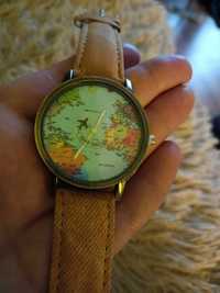 Zegarek z mapa na tarczy