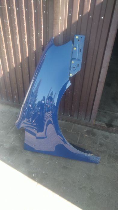 ) Touran 1 błotnik przedni prawy wy LL5M