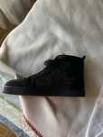 Christian Louboutin preta