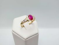 Złoty pierścionek z purpurowym oczkiem 2,88g 585 14K R. 21