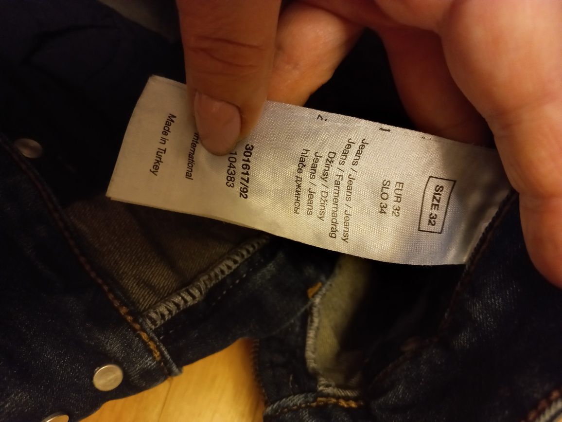 Spodnie jeans Orsay W32 L34 ciemny jeans z przetarciami