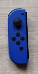 Jeden granatowy joy-con firmy Nintendo