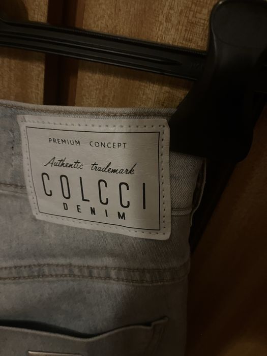 Calças Colcci de ganga elásticas,com recortes dos lados,como novas,36