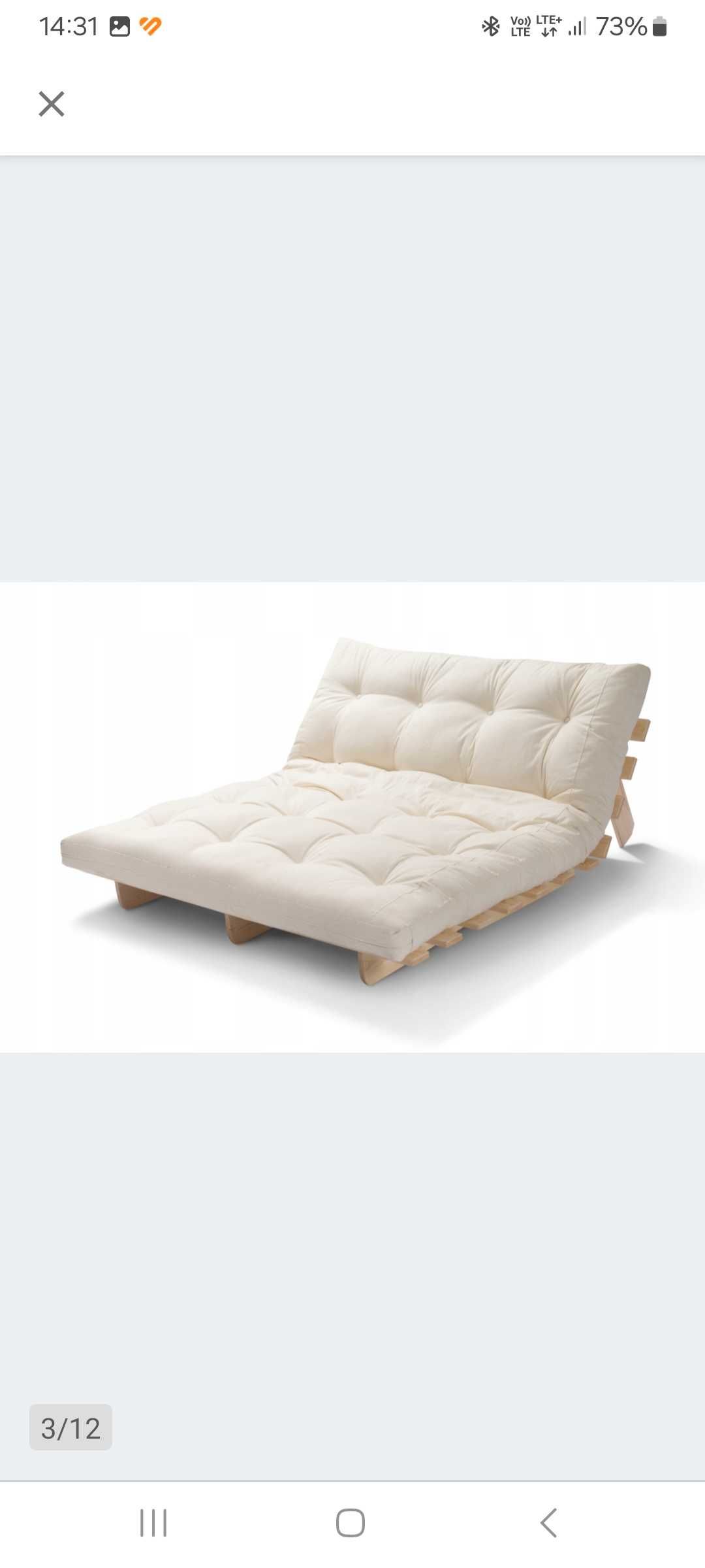 Fotel rozkładany z materacem futon.