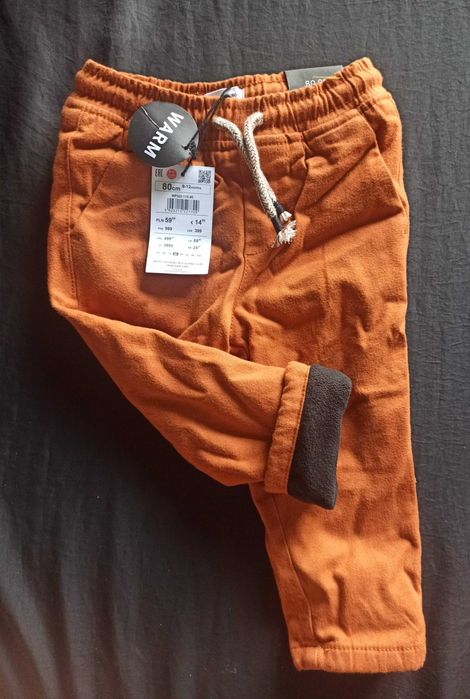 Nowe ocieplane spodnie chinosy reserved roz 80