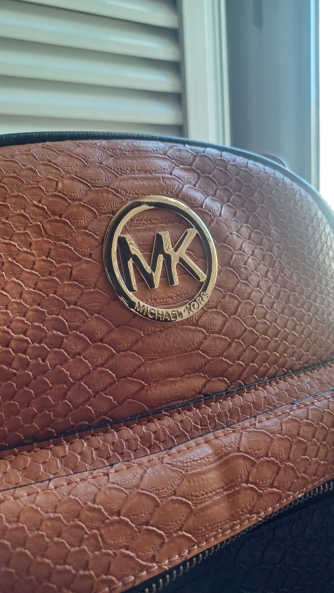 Mochila MK pouco usada