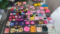 100 Malas, mochilas, bolsas, baús, carteiras barbie desde 1€ cada