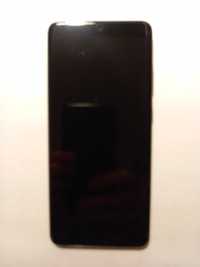 Telefon smartfon Samsung Galaxy S20 Plus z etui firmy Samsung.