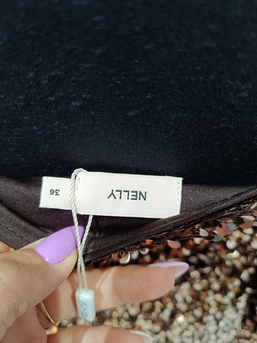 Cekinowa,elegancka sukienka o dużej objętości Nelly,rozmiar 36,impreza